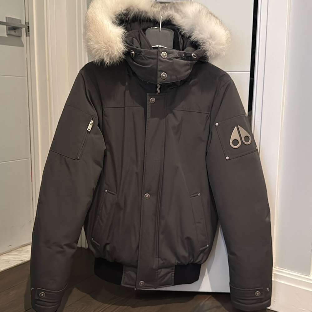 Grey unisex moose knuckles bomber jacket with white fur